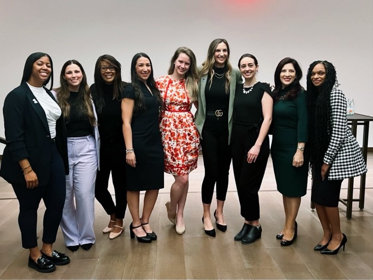 A group of women posing for a photo

    Description automatically generated